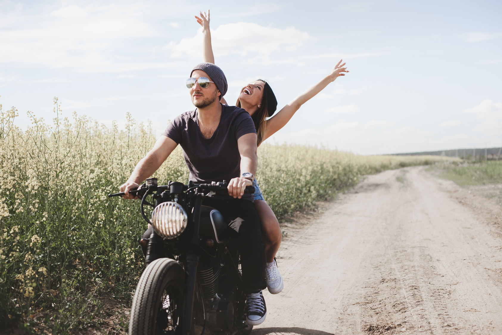 Couple in Field on Motorcycle