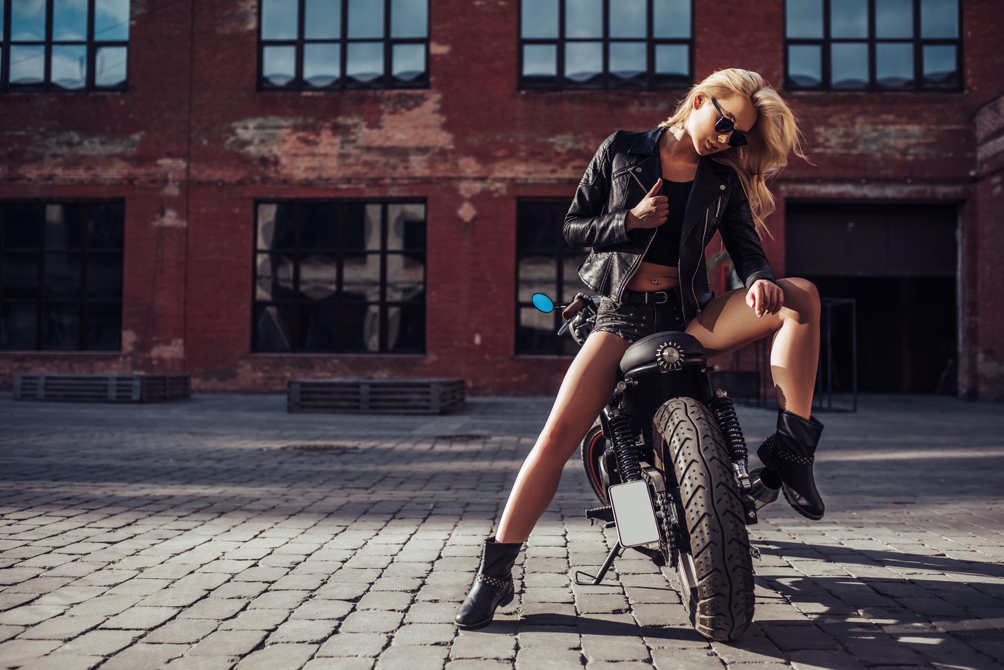 Woman with black motorcycle